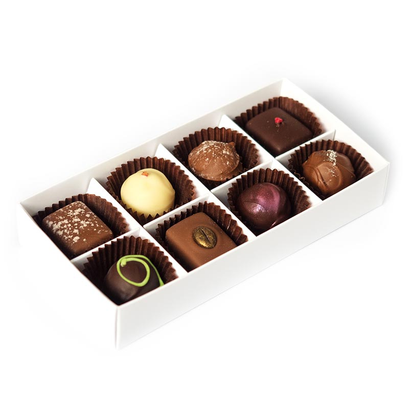 Eight handmade truffles packed in a large box