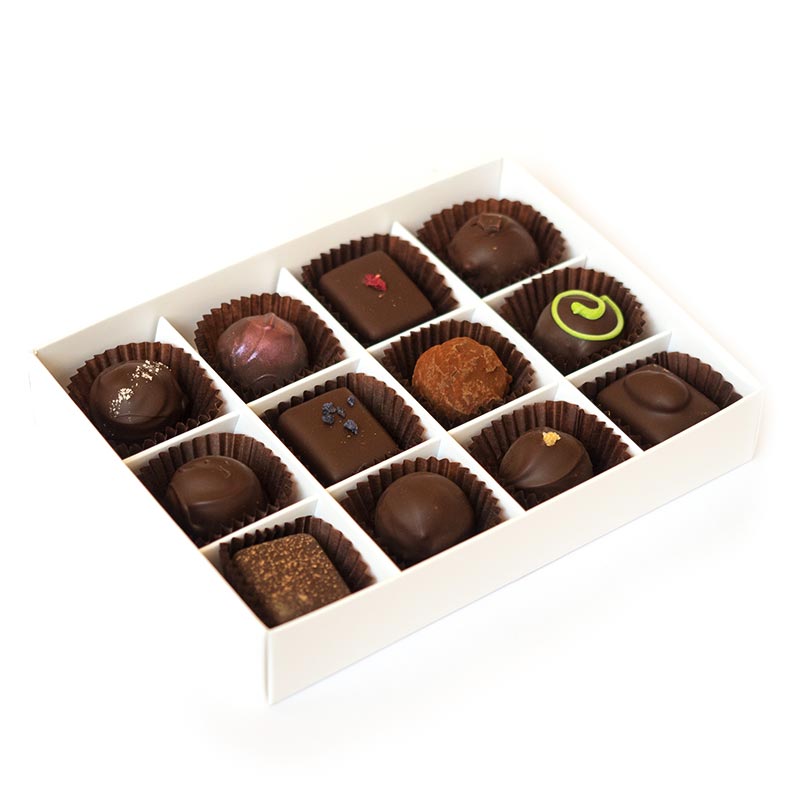 Twelve handmade dark truffles packed in a large box