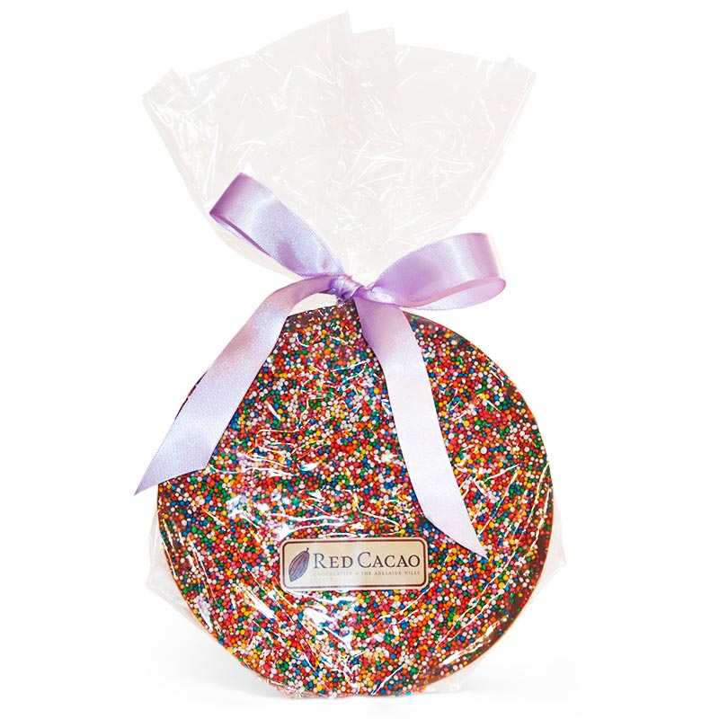 A giant milk chocolate freckle covered with multicoloured hundreds and thousands