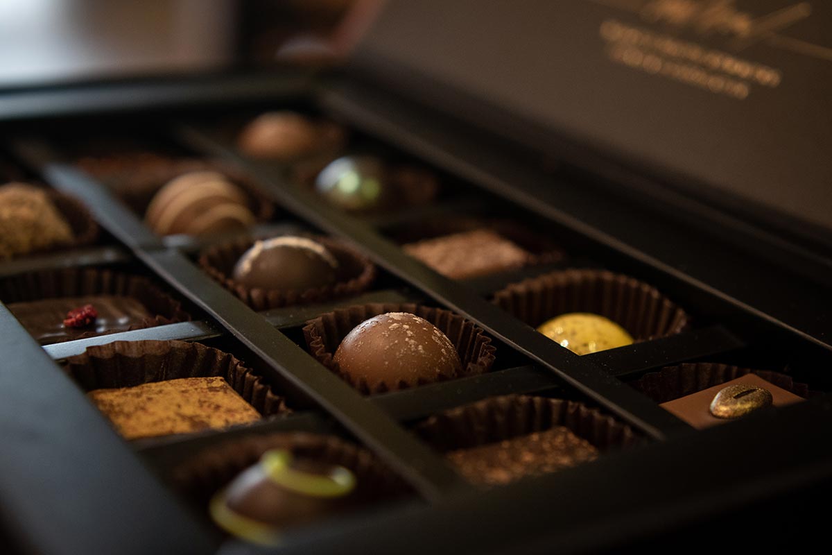 Open box display of the signature collection of red cacao's finest truffles